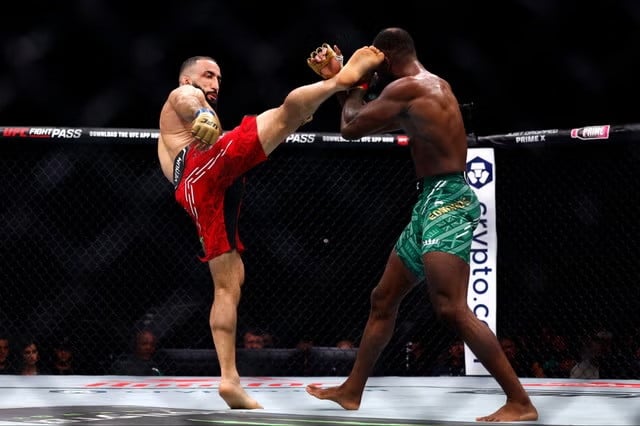 Belal Muhammad kicks Leon Edwards. PHOTO: REUTERS